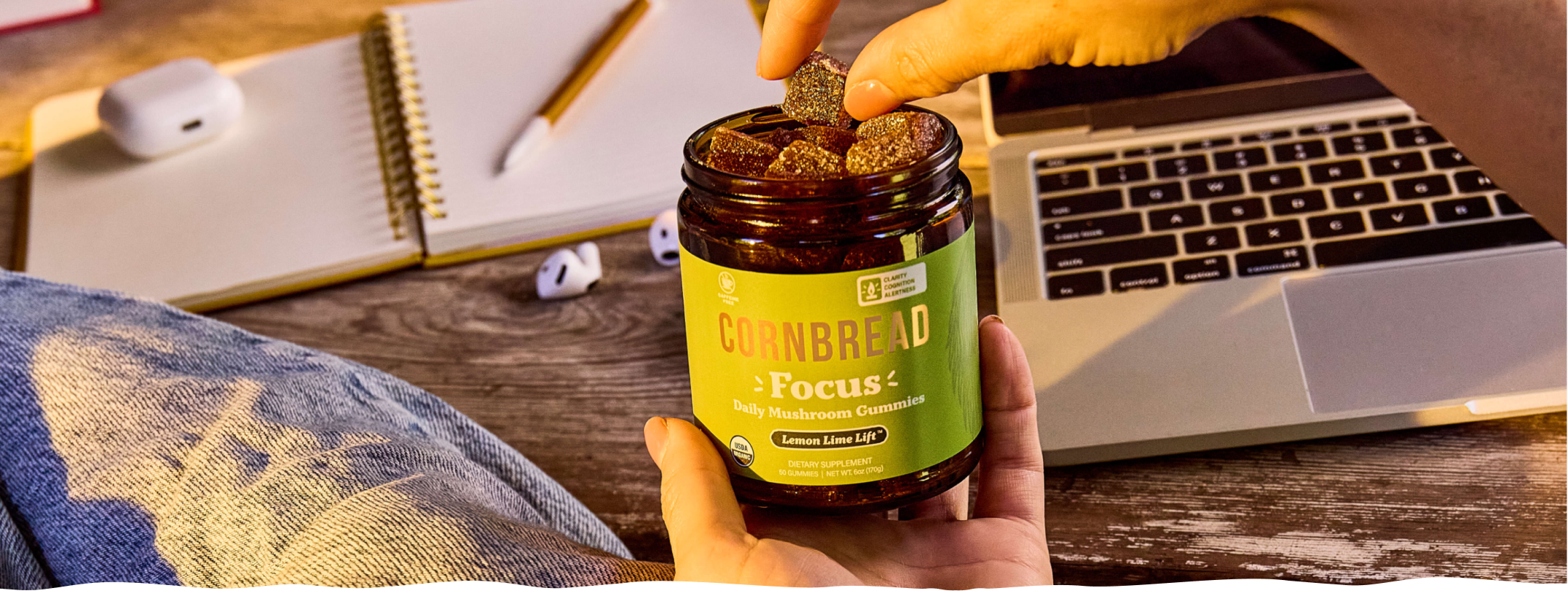 A person working at a desk with Cornbread Hemp Mushroom Focus Gummies