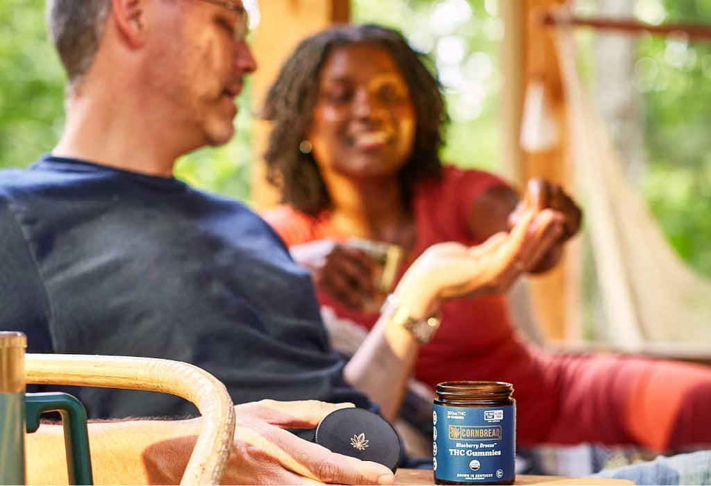 Two people enjoy Cornbread Hemp THC gummies.